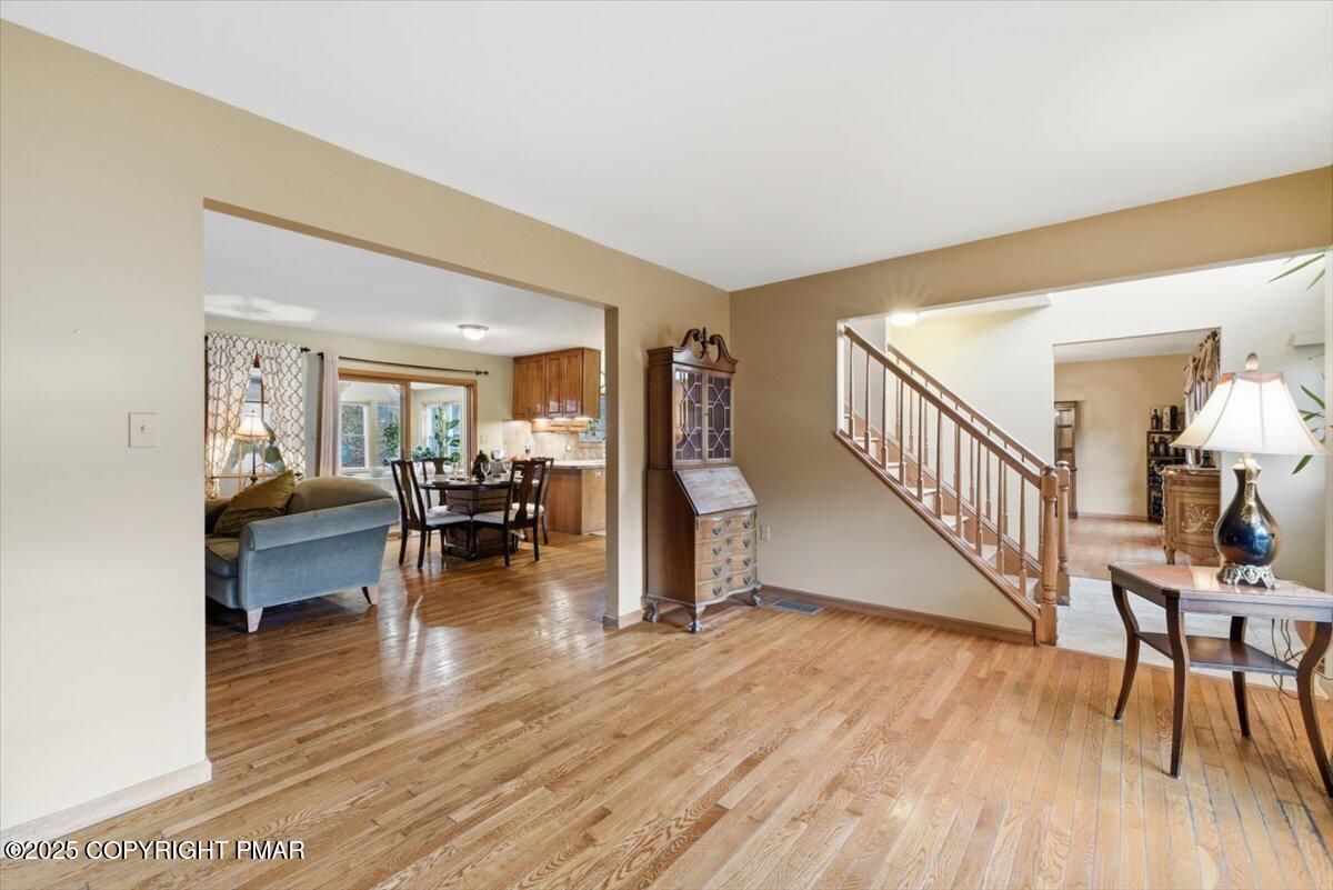 102 Arbor Way Stroudsburg, PA 18360 - Photo 18 of 51 a living room with furniture and a wooden floor