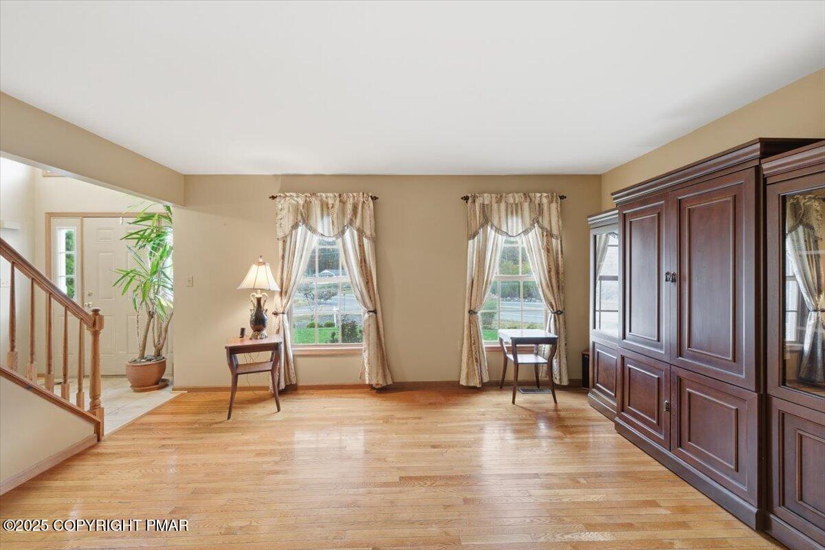 102 Arbor Way Stroudsburg, PA 18360 - Photo 20 of 51 a view of an empty room with wooden floor and a window