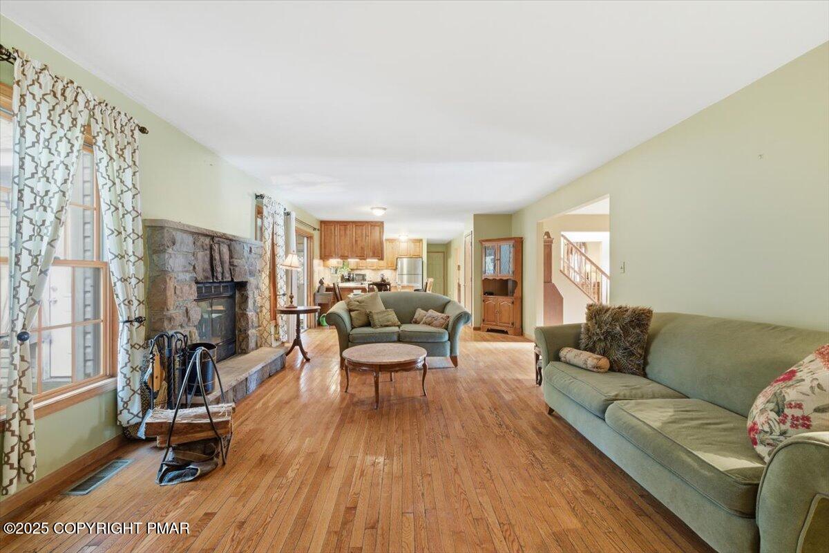 102 Arbor Way Stroudsburg, PA 18360 - Photo 22 of 50 a living room with furniture and a wooden floor