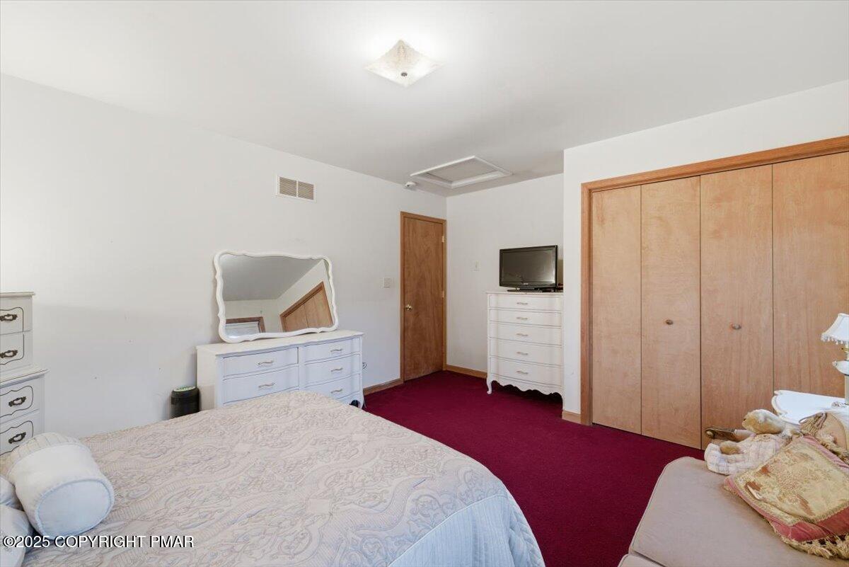 102 Arbor Way Stroudsburg, PA 18360 - Photo 36 of 51 a bedroom with a bed and wooden floor