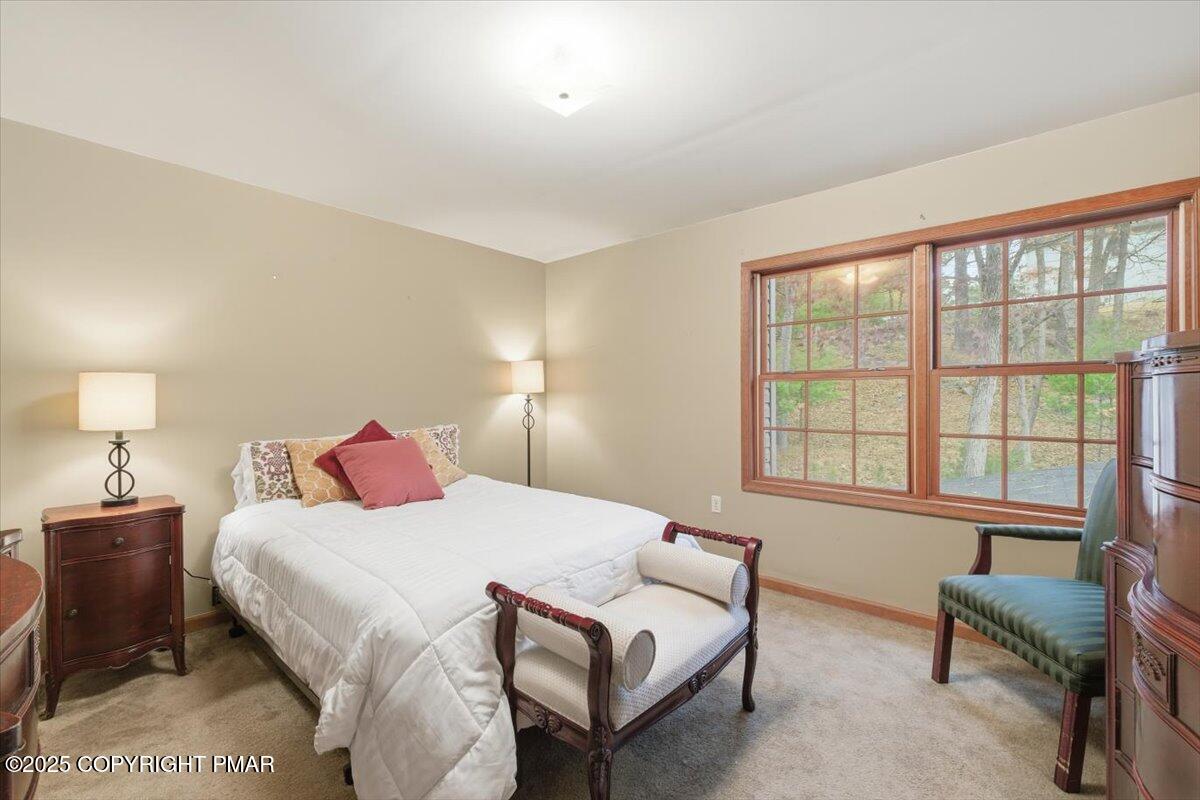 102 Arbor Way Stroudsburg, PA 18360 - Photo 38 of 51 a bedroom with a bed and a couch