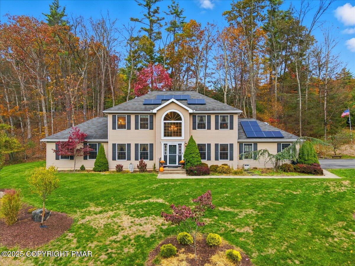 102 Arbor Way Stroudsburg, PA 18360 - Photo 4 of 51 a front view of house with yard and trees in the background