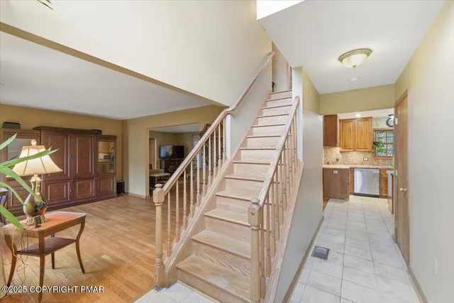 a view of a hallway with furniture and entryway