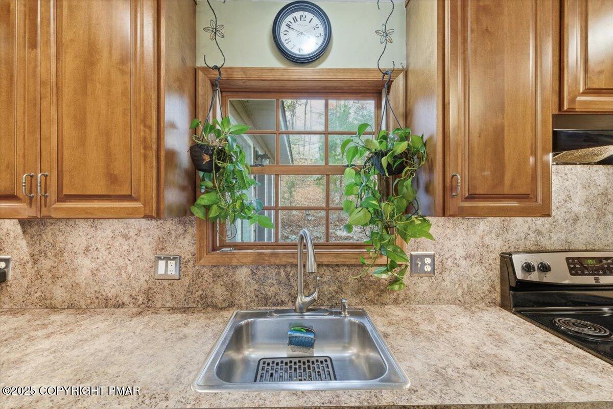 102 Arbor Way Stroudsburg, PA 18360 - Photo 8 of 51 a kitchen with a sink and a stove top oven