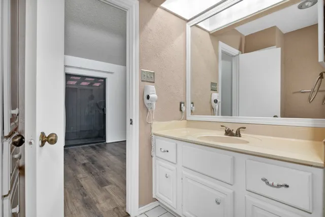 a bathroom with a bath tub a sink and a shower