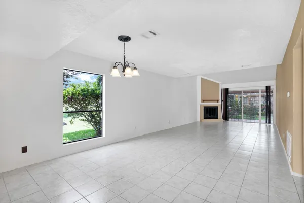 a view of a kitchen with an empty space and kitchen view