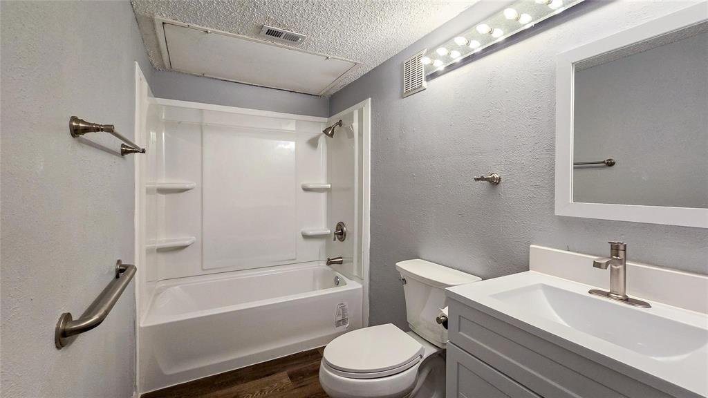 1526 Toyah Creek Lane Garland, TX 75040 - Photo 9 of 10 a bathroom with a sink toilet and shower