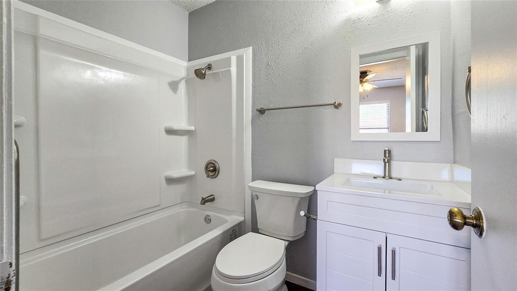1526 Toyah Creek Lane Garland, TX 75040 - Photo 10 of 10 a bathroom with a sink toilet and shower