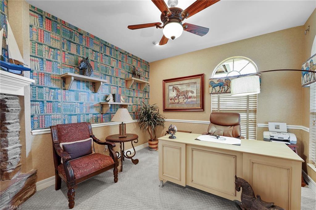 8862 Lely Island Circle Naples, FL 34113 - Photo 25 of 47 a work room with furniture and a chandelier