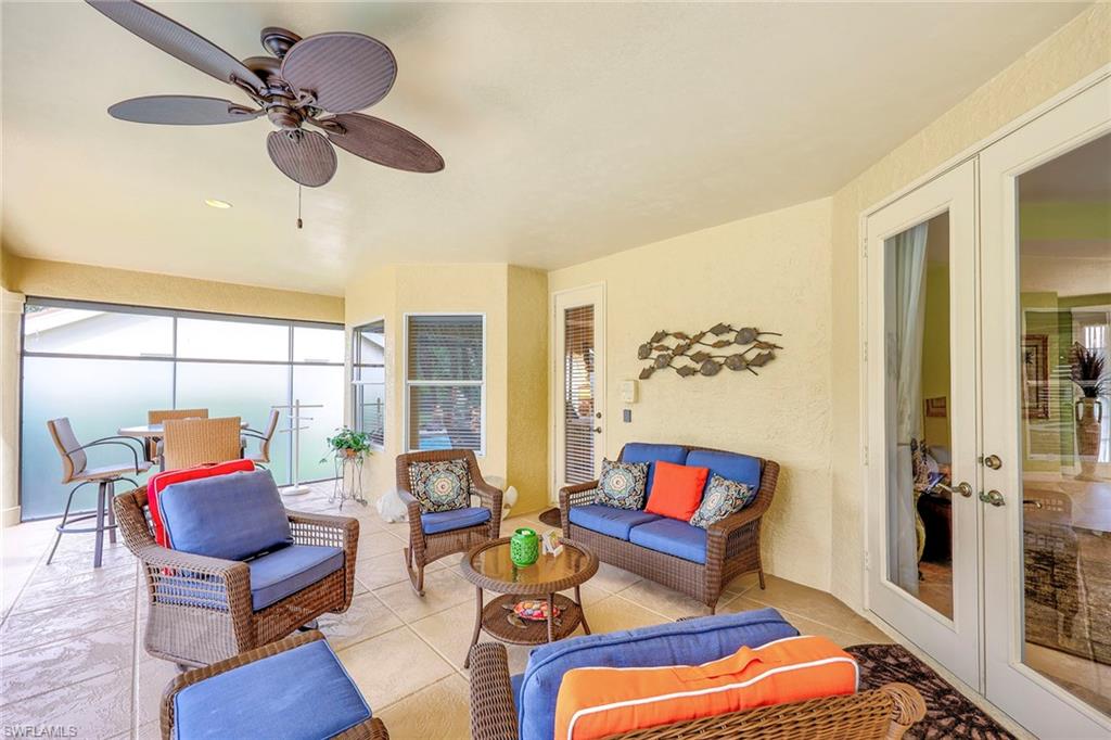 8862 Lely Island Circle Naples, FL 34113 - Photo 30 of 47 a living room with furniture and a window