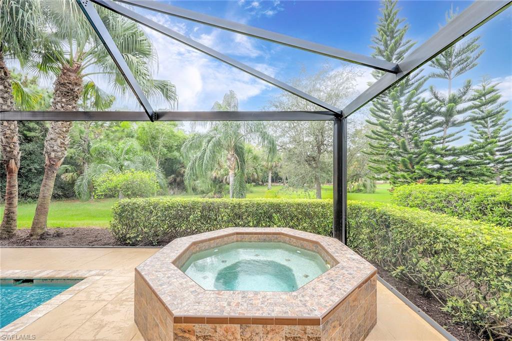 8862 Lely Island Circle Naples, FL 34113 - Photo 32 of 47 a view of swimming pool from a yard
