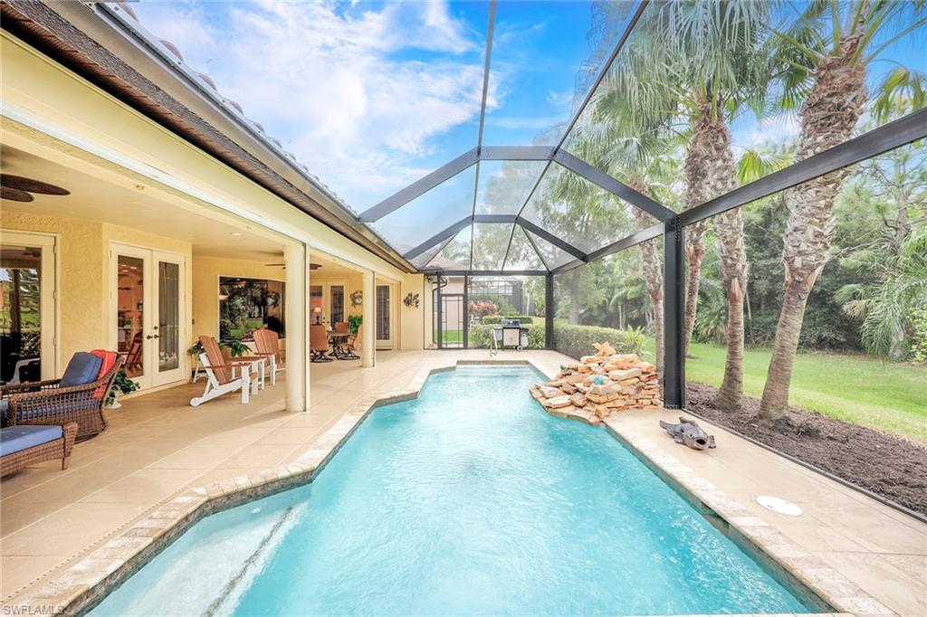 8862 Lely Island Circle Naples, FL 34113 - Photo 35 of 47 a building outdoor space with seating space