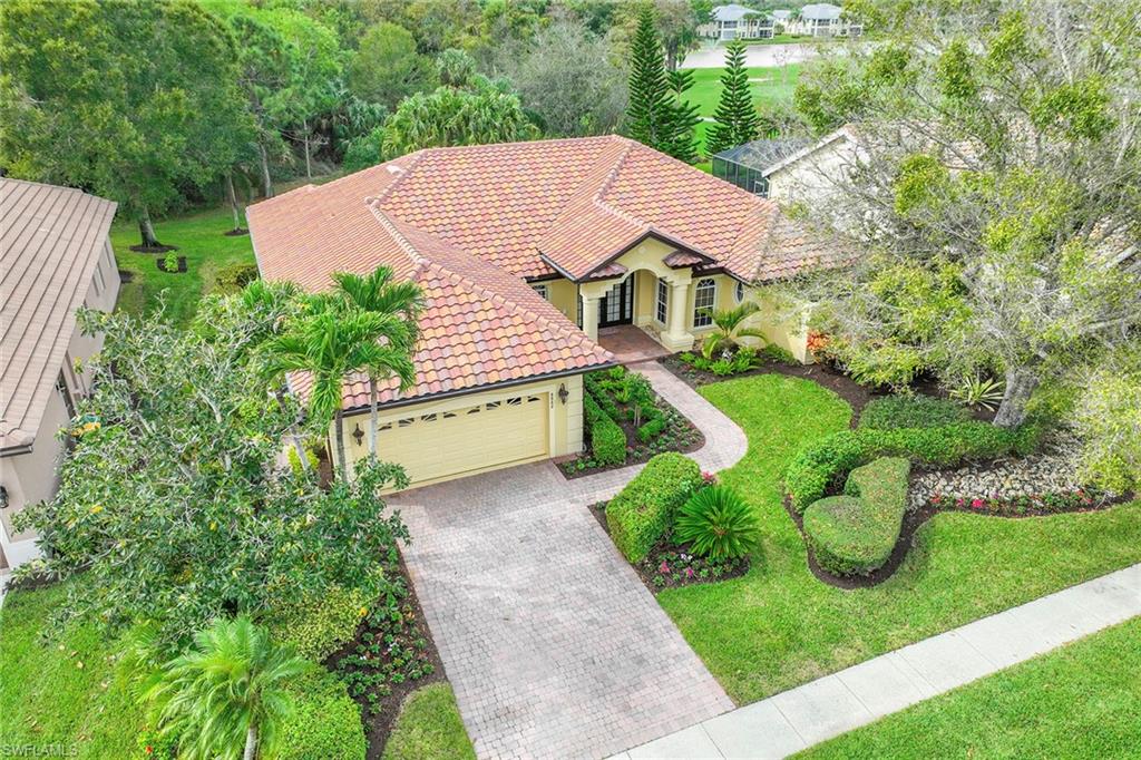 8862 Lely Island Circle Naples, FL 34113 - Photo 38 of 47 a aerial view of a house with garden