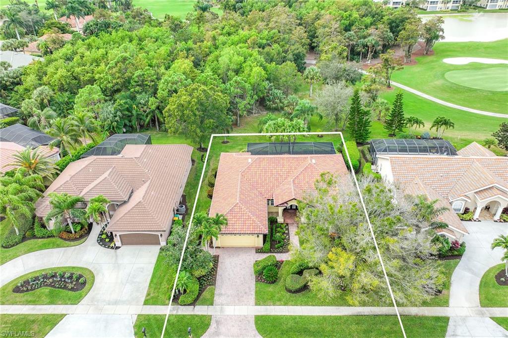 8862 Lely Island Circle Naples, FL 34113 - Photo 40 of 47 an aerial view of house with a swimming pool