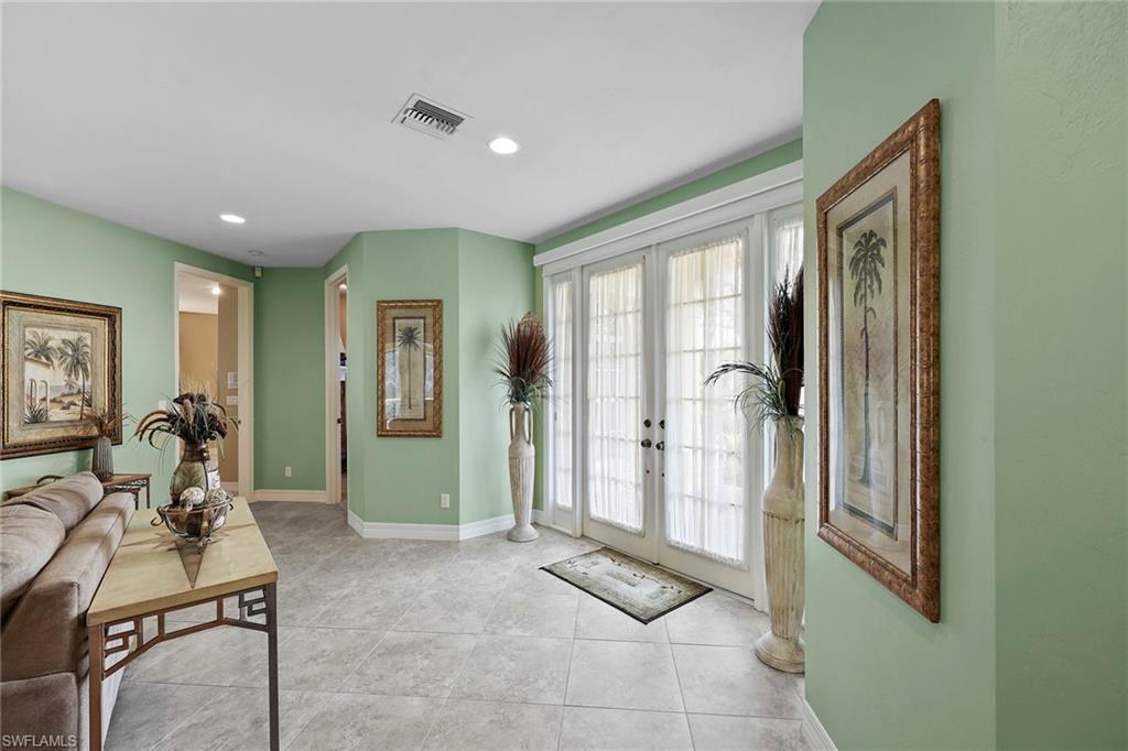 8862 Lely Island Circle Naples, FL 34113 - Photo 4 of 47 a view of a livingroom with furniture and windows
