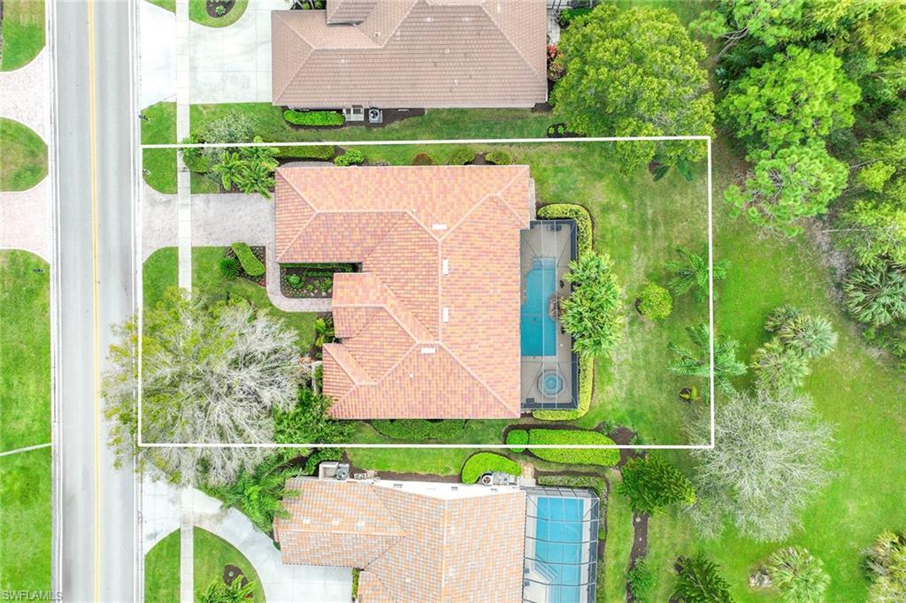 8862 Lely Island Circle Naples, FL 34113 - Photo 44 of 47 an aerial view of a house with a yard and outdoor seating