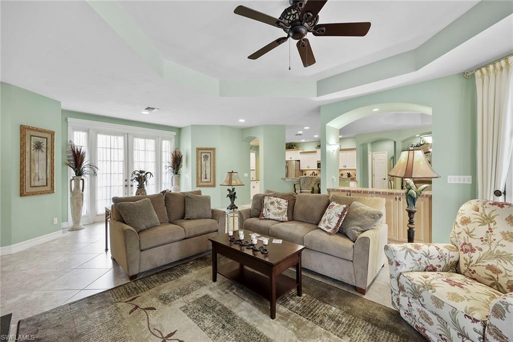 8862 Lely Island Circle Naples, FL 34113 - Photo 8 of 47 a living room with furniture and a large window