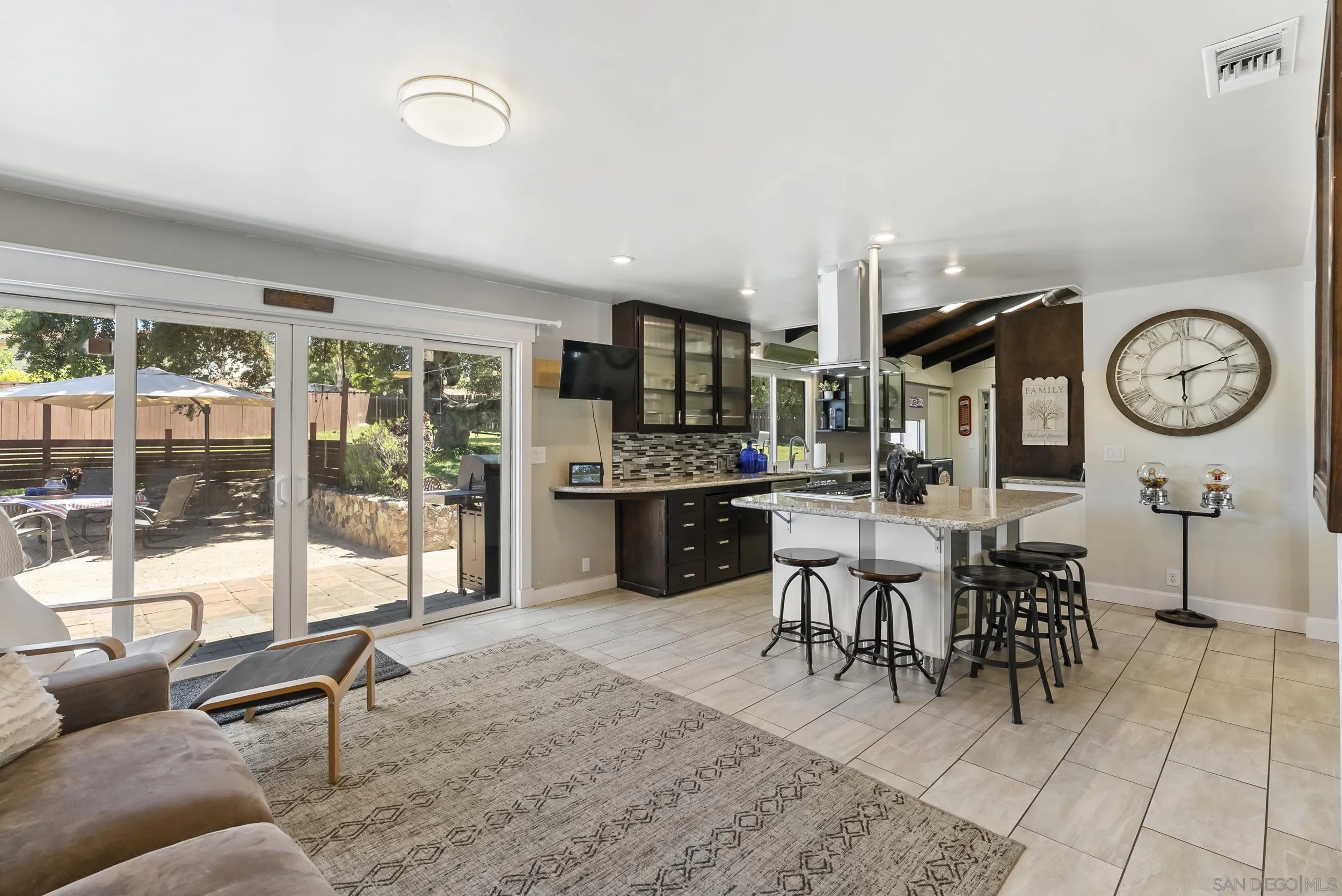 2824 Scenic View Road Alpine, CA 91901 - Photo 18 of 42 a living room with furniture a clock and a large window