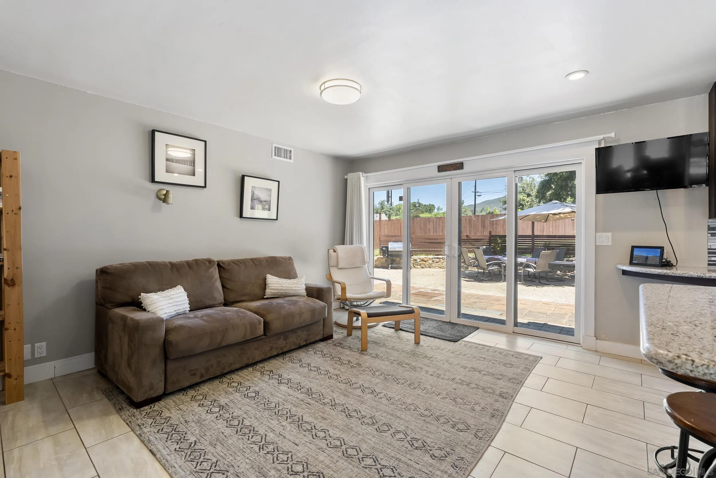 2824 Scenic View Road Alpine, CA 91901 - Photo 19 of 42 a living room with furniture and a flat screen tv
