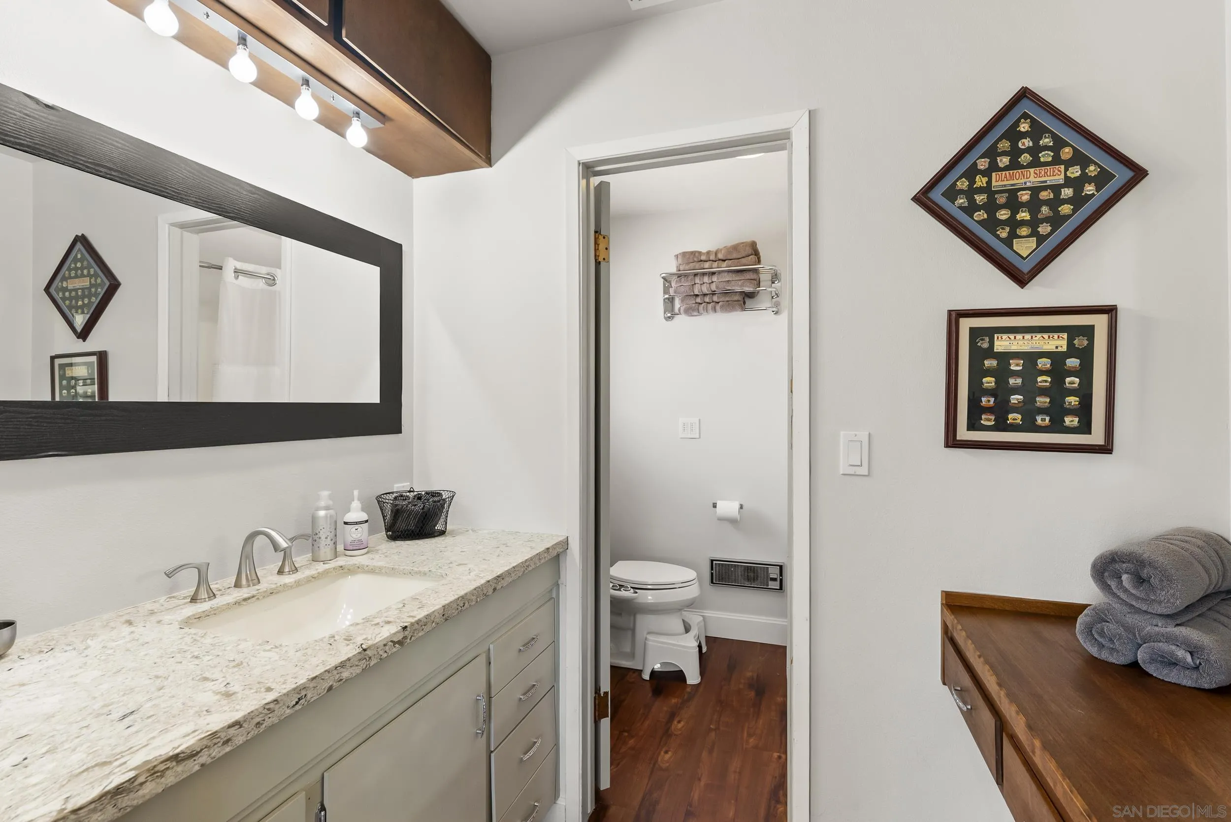 2824 Scenic View Road Alpine, CA 91901 - Photo 26 of 42 a bathroom with a granite countertop sink mirror and toilet