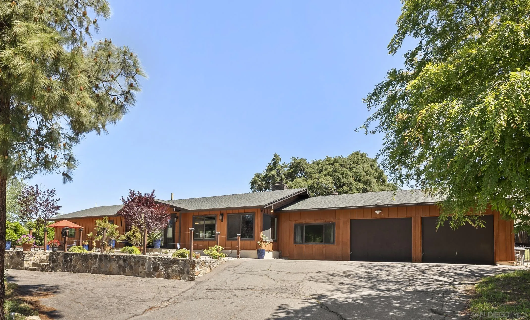 2824 Scenic View Road Alpine, CA 91901 - Photo 3 of 42 a front view of a house with a yard and garage