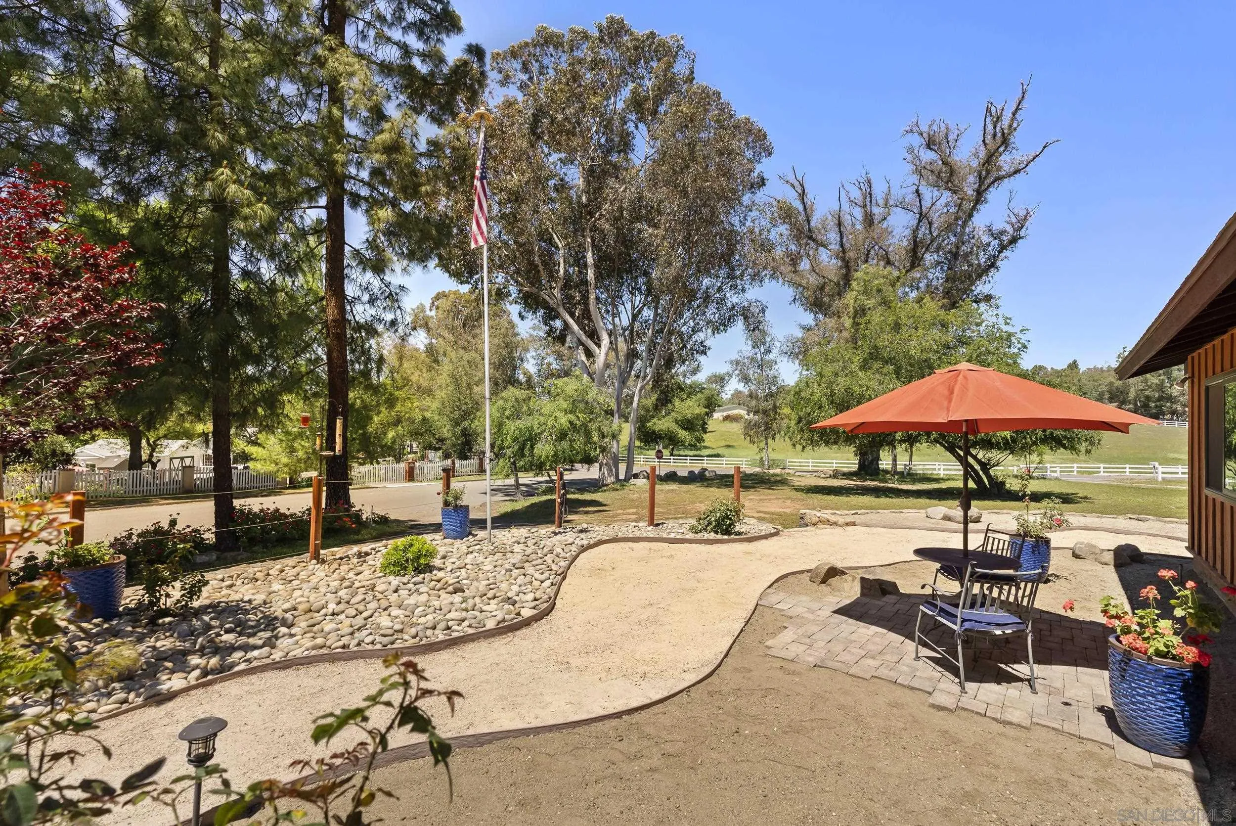 2824 Scenic View Road Alpine, CA 91901 - Photo 5 of 42 a view of a patio with a table and chairs under an umbrella