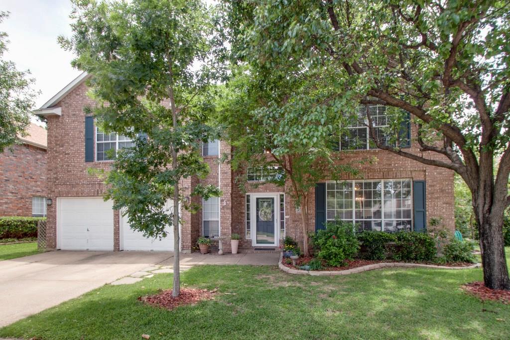 2525 Timber Ridge Lane Flower Mound, TX 75022 - Photo 1 of 1 a front view of a house with a garden