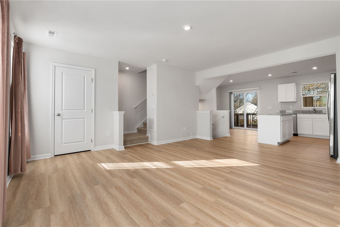 109 Brooklane Court Easley, SC 29642 - Photo 15 of 47 This bright and airy open-concept living space seamlessly connects to a modern kitchen.