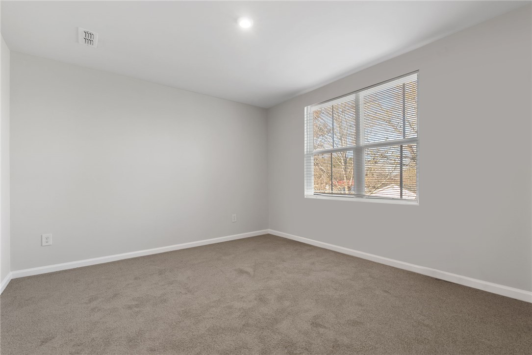 109 Brooklane Court Easley, SC 29642 - Photo 17 of 47 Bright and airy room with plush carpet, offering a tranquil space to unwind.