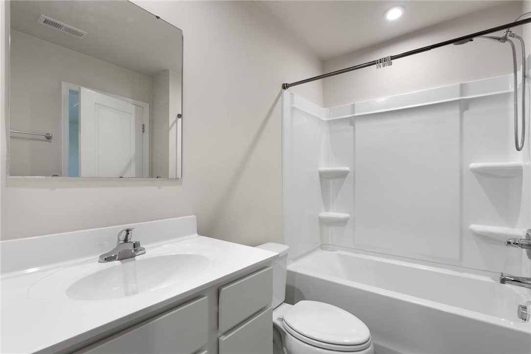 109 Brooklane Court Easley, SC 29642 - Photo 20 of 47 This bright bathroom features a vanity, mirror, and a shower-tub combination.