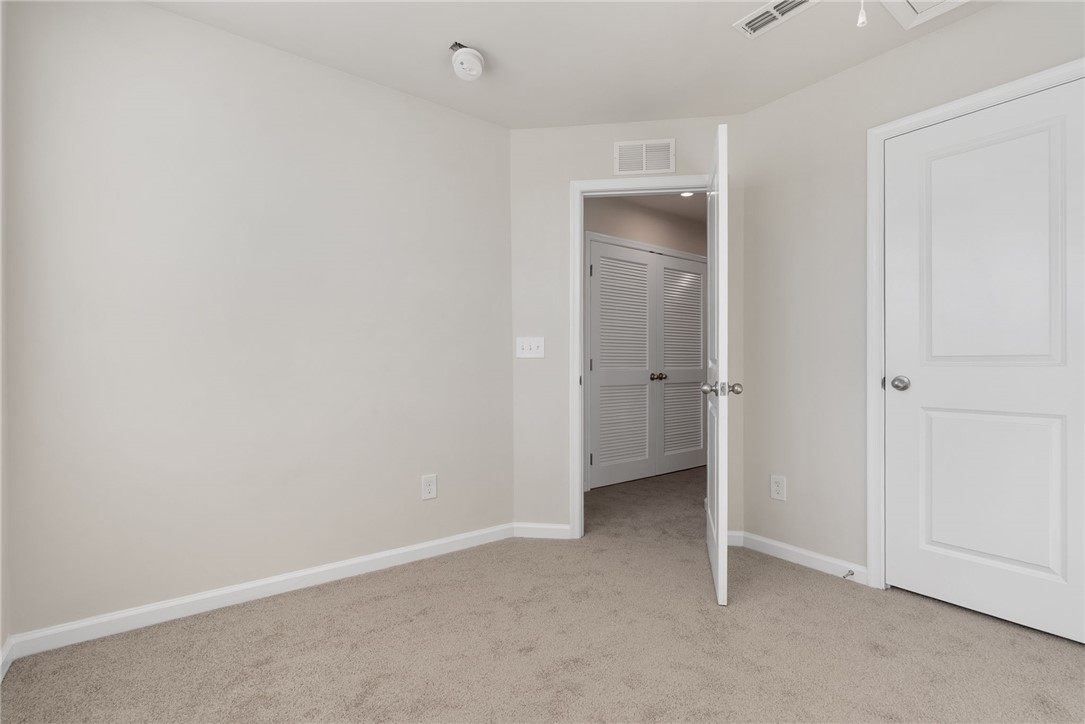 109 Brooklane Court Easley, SC 29642 - Photo 24 of 47 This spacious bedroom offers comfortable carpeting and convenient closet access.