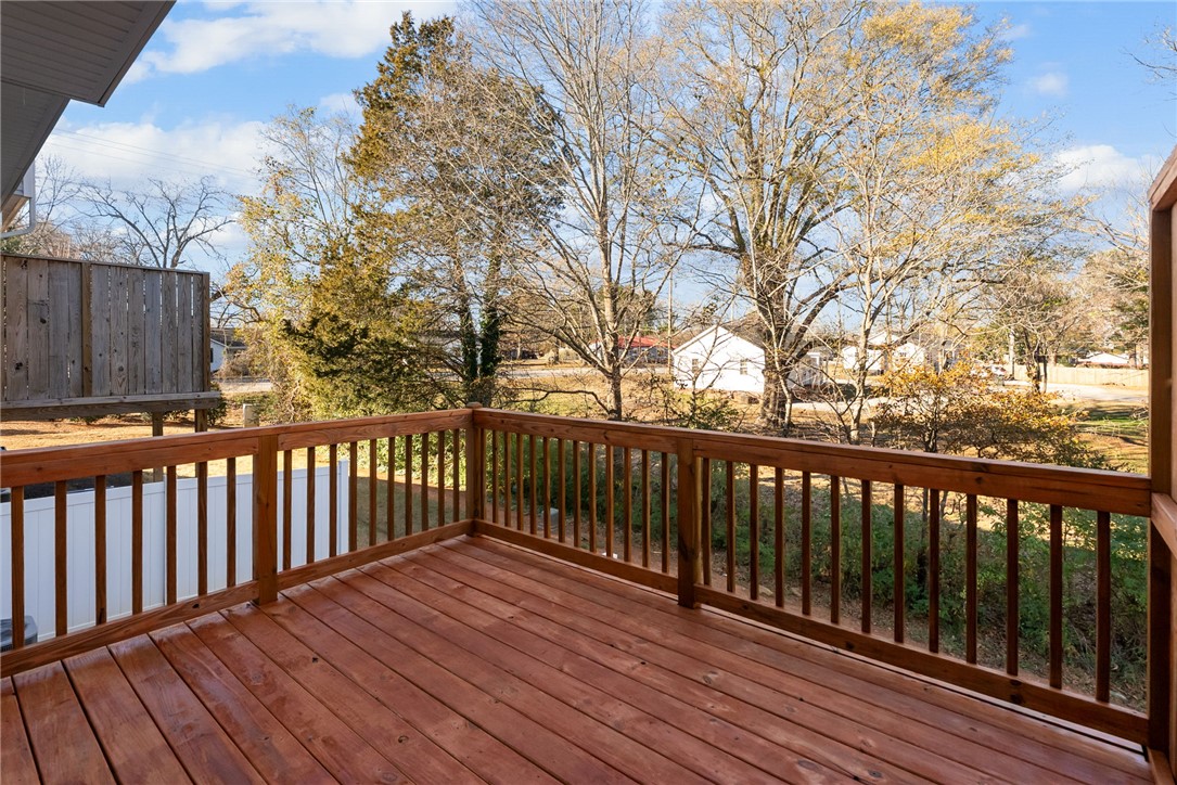 109 Brooklane Court Easley, SC 29642 - Photo 31 of 47 This spacious wooden deck offers an elevated view of the surrounding trees and neighborhood.