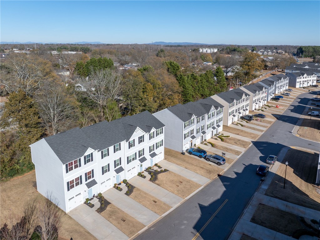 109 Brooklane Court Easley, SC 29642 - Photo 40 of 47 This residential street showcases a row of modern townhomes, perfect for contemporary living.