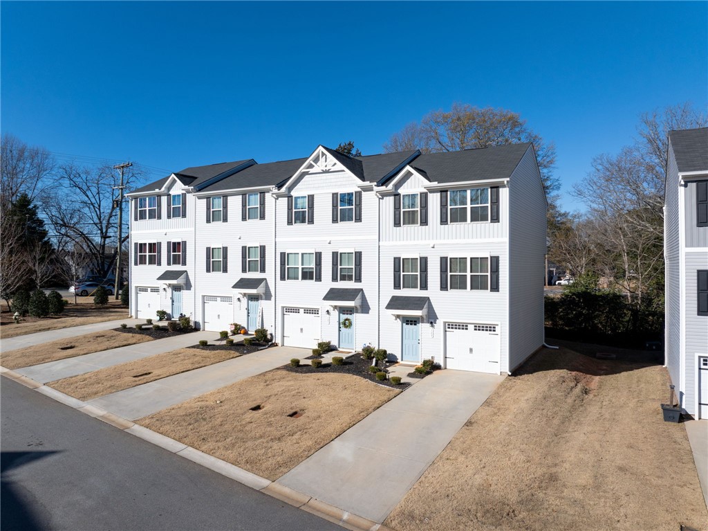 109 Brooklane Court Easley, SC 29642 - Photo 41 of 47 These modern townhomes feature individual garages and inviting entrances, perfect for contemporary living.