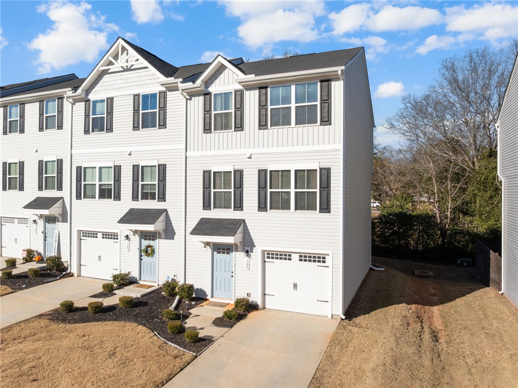 109 Brooklane Court Easley, SC 29642 - Photo 43 of 47 This townhome features a clean exterior and an attached garage, ready for convenient living.