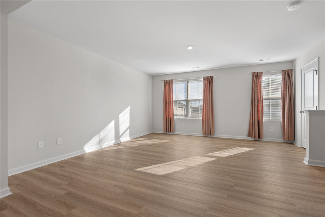 109 Brooklane Court Easley, SC 29642 - Photo 8 of 47 This airy room features ample natural light and durable flooring, perfect for versatile living.