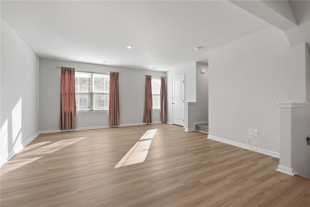 109 Brooklane Court Easley, SC 29642 - Photo 9 of 47 This airy living space features abundant natural light and durable flooring, perfect for versatile living.