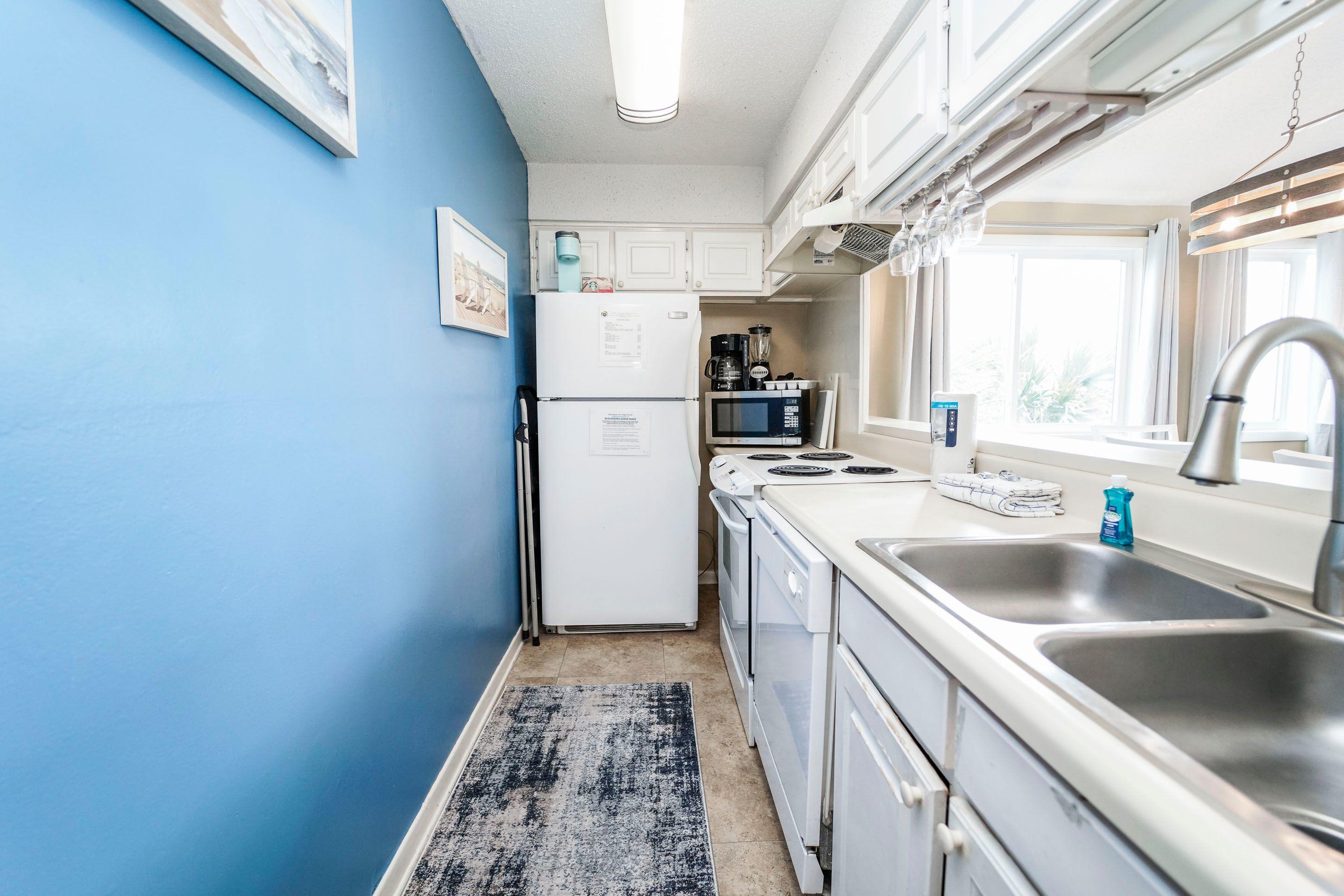7998 East County Highway 30A, Unit 7 Inlet Beach, FL 32461 - Photo 12 of 16 a kitchen that has a sink and a refrigerator