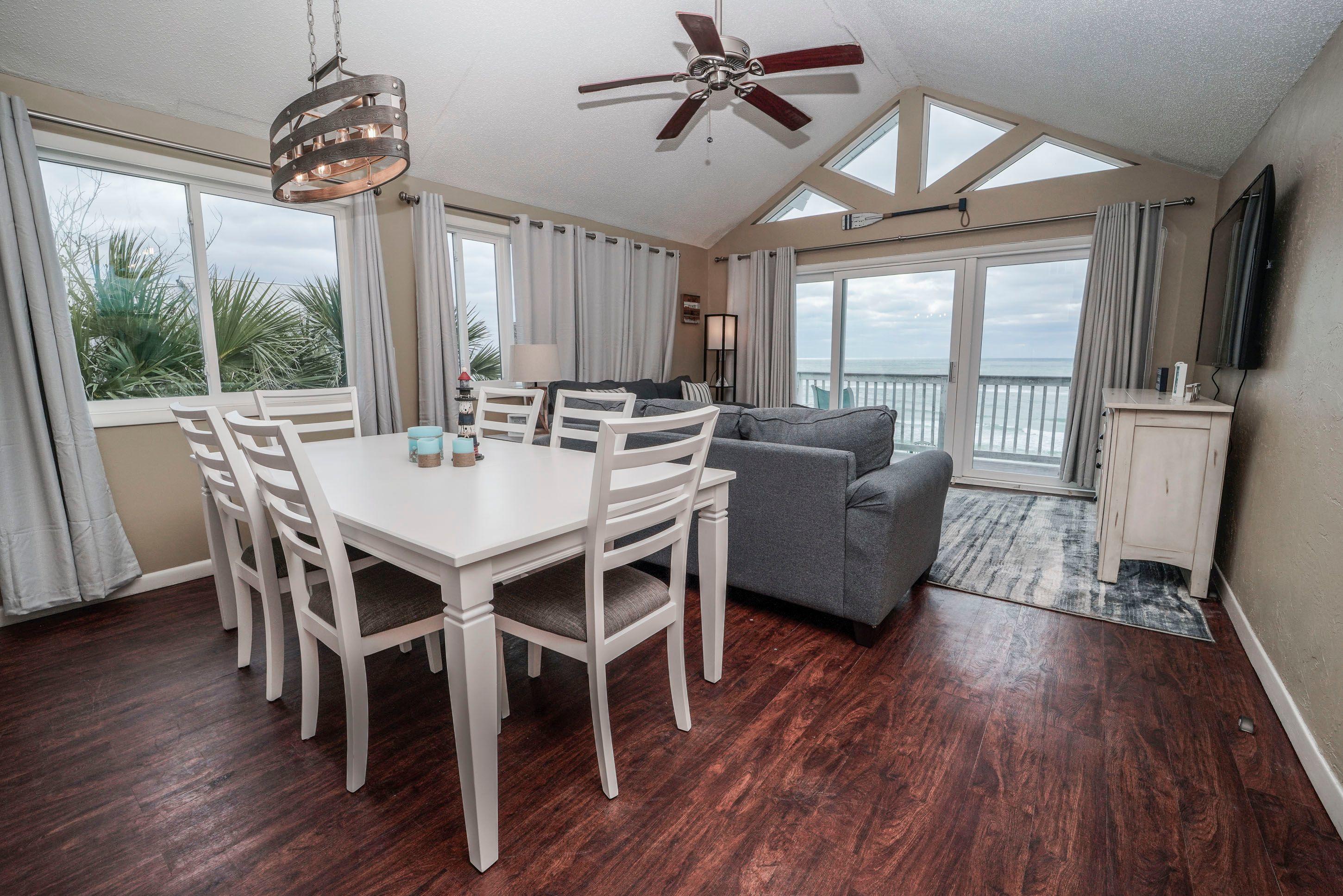 7998 East County Highway 30A, Unit 7 Inlet Beach, FL 32461 - Photo 9 of 16 a view of a dining room with furniture window and wooden floor
