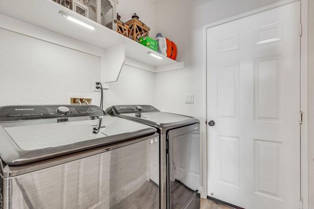 a kitchen with a sink and a refrigerator