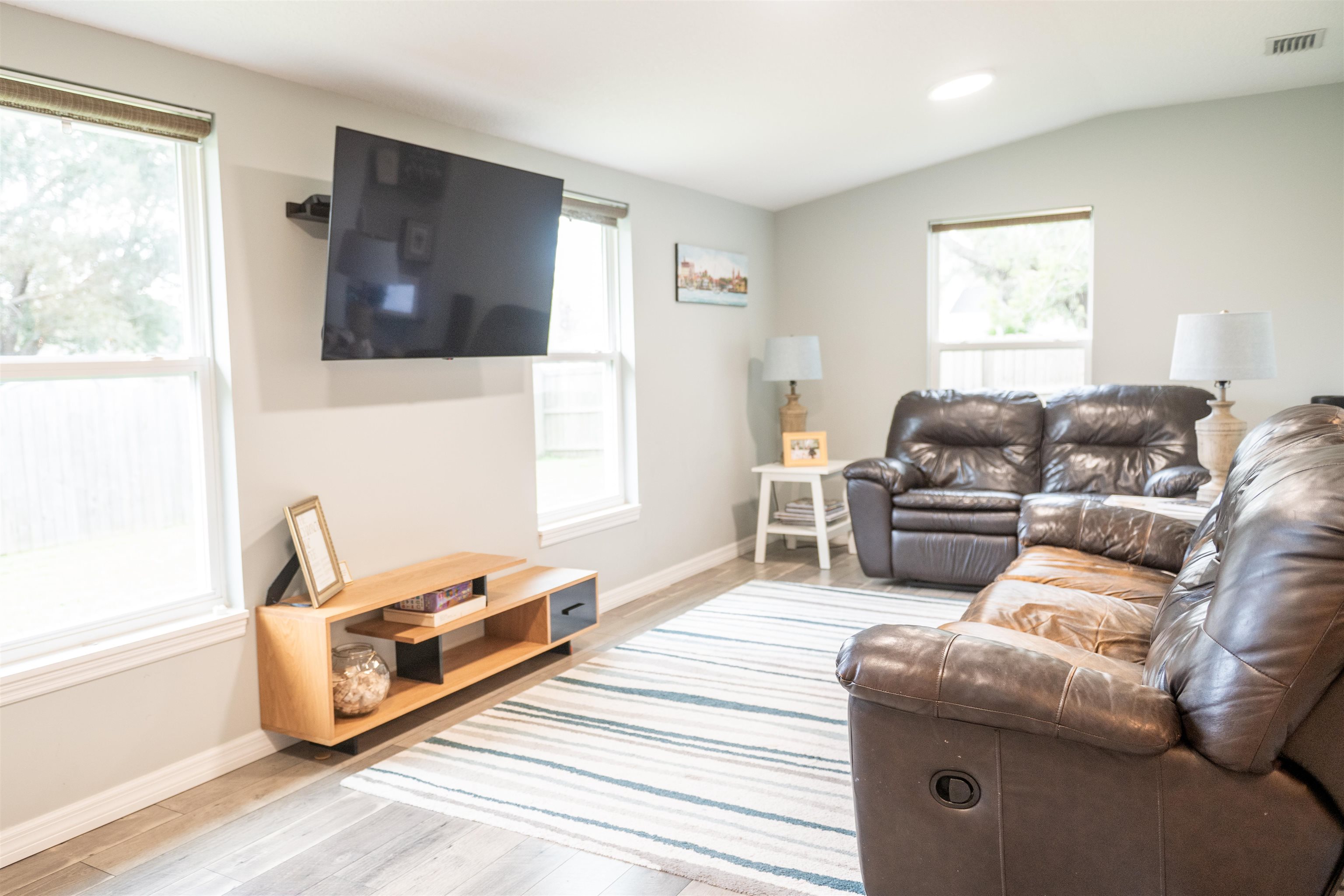 321 Harvard Road St. Augustine, FL 32086 - Photo 11 of 35 a living room with furniture and a flat screen tv