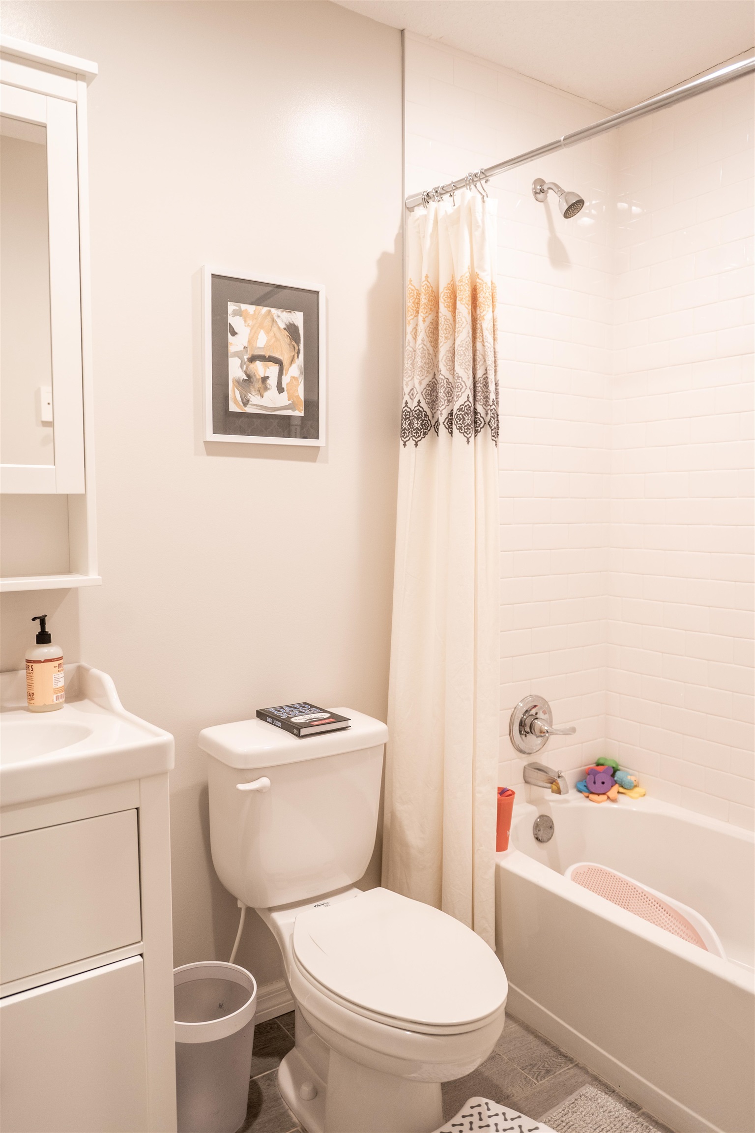 321 Harvard Road St. Augustine, FL 32086 - Photo 22 of 35 a white toilet sitting next to a bathroom sink and tub