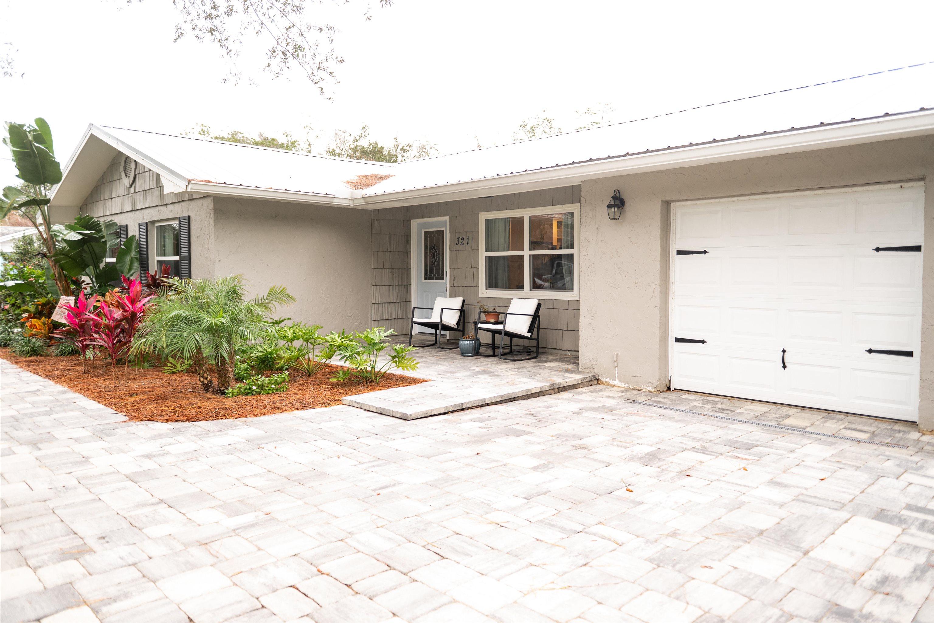 321 Harvard Road St. Augustine, FL 32086 - Photo 4 of 35 a view of a house with a patio