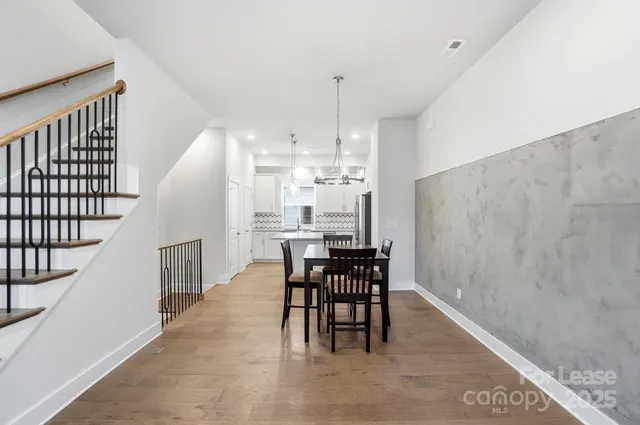 a view of an empty room with glass door and a window