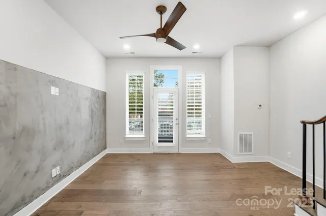 a kitchen with kitchen island a counter top space stainless steel appliances and cabinets