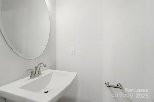 a view of a balcony with wooden floor and fence