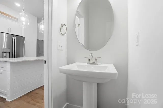 a view of a balcony with wooden floor and fence