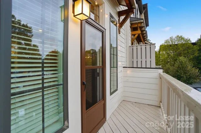 a view of a backyard with swimming pool and furniture