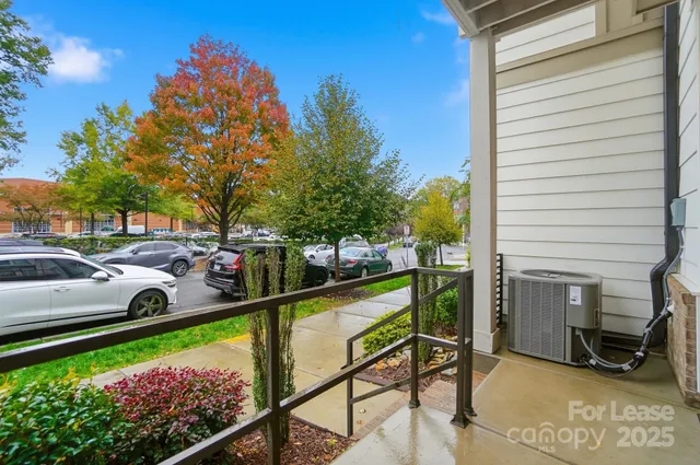 a view of a chair and table in the balcony