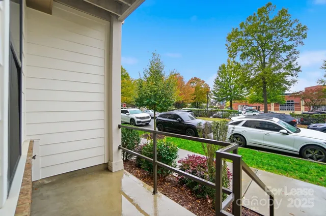 a view of a yard with cars parked